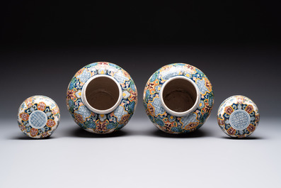 A rare pair of polychrome Dutch Delft chinoiserie jars and covers, 18th C.