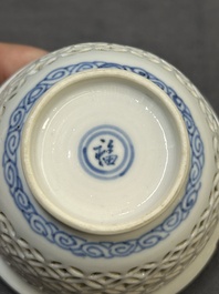 A Chinese blue and white reticulated double-walled cup and saucer, fu mark, Kangxi