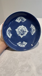 A Chinese blue and white 'phoenix and monkeys' dish and a pair of powder-blue-ground plates, Kangxi/Yongzheng