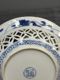 A Chinese blue and white reticulated double-walled cup and saucer, fu mark, Kangxi