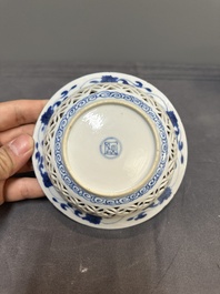 A Chinese blue and white reticulated double-walled cup and saucer, fu mark, Kangxi