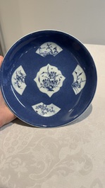 A Chinese blue and white 'phoenix and monkeys' dish and a pair of powder-blue-ground plates, Kangxi/Yongzheng