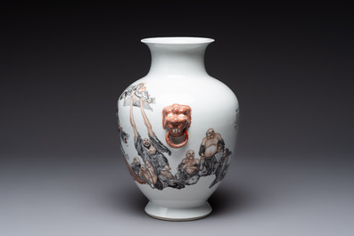 A Chinese iron-red-decorated grisaille '18 Luohan' vase, Qianlong mark, dated 1993