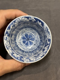 A Chinese blue and white reticulated double-walled cup and saucer, fu mark, Kangxi