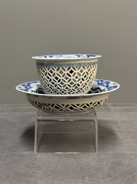 A Chinese blue and white reticulated double-walled cup and saucer, fu mark, Kangxi