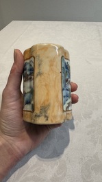 A Chinese famille rose 'faux-marbre' quadrifoil brush pot, Qianlong mark, 19th C.