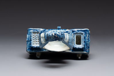 A blue and white Dutch Delft inkwell with pocket watch holder, 18th C.