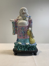 A Chinese famille rose Milefo Buddha on wooden stand, 19th C.