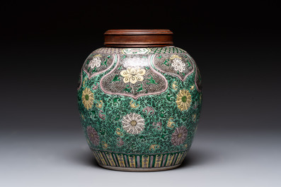 A Chinese verte biscuit 'lotus scroll' jar with wooden cover, Qing