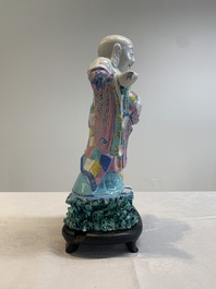 A Chinese famille rose Milefo Buddha on wooden stand, 19th C.