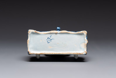 A blue and white Dutch Delft inkwell with pocket watch holder, 18th C.
