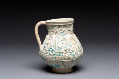 A green-glazed and a turquoise-glazed Kashan jug, Persia, 12/13th C.