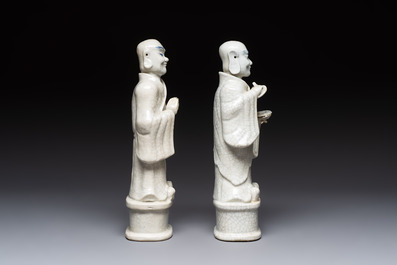 A pair of Chinese blue and white crackle-glazed monks, 19th C.