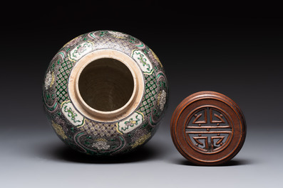 A Chinese verte biscuit 'lotus scroll' jar with wooden cover, Qing