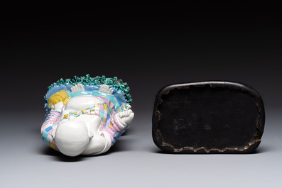 A Chinese famille rose Milefo Buddha on wooden stand, 19th C.