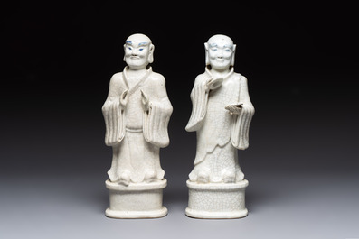 A pair of Chinese blue and white crackle-glazed monks, 19th C.