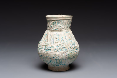 A green-glazed and a turquoise-glazed Kashan jug, Persia, 12/13th C.