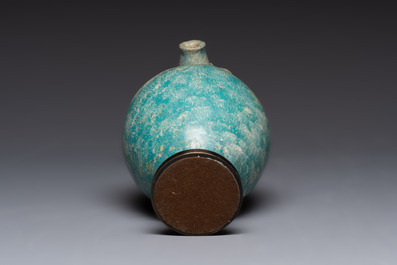 A green-glazed and a turquoise-glazed Kashan jug, Persia, 12/13th C.