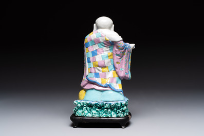 A Chinese famille rose Milefo Buddha on wooden stand, 19th C.