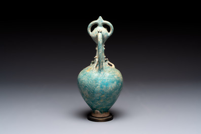 A green-glazed and a turquoise-glazed Kashan jug, Persia, 12/13th C.