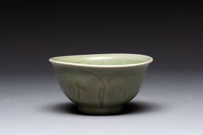 A Chinese Longquan celadon 'gu' vase with 'anhua' floral design and a bowl, Ming