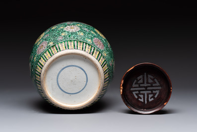A Chinese verte biscuit 'lotus scroll' jar with wooden cover, Qing