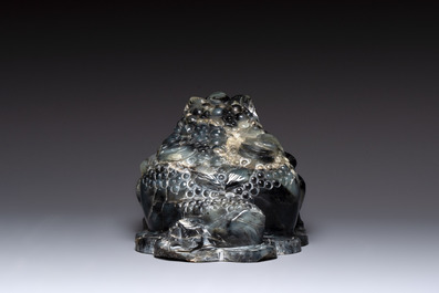 A Chinese jade group of an imperial carriage with mythical beasts and a large three-legged toad, 20th C.
