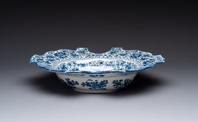 A very rare and large blue and white Dutch Delft double barber's bowl with floral design, late 17th C.