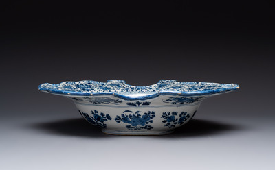 A very rare and large blue and white Dutch Delft double barber's bowl with floral design, late 17th C.