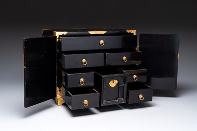 A rare Japanese black-lacquered cabinet with finely engraved gilt mounts, Edo, late 17th C.