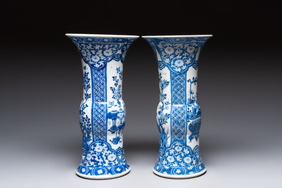 A pair of Chinese blue and white 'gu' vases with floral design, Kangxi