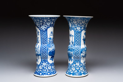 A pair of Chinese blue and white 'gu' vases with floral design, Kangxi