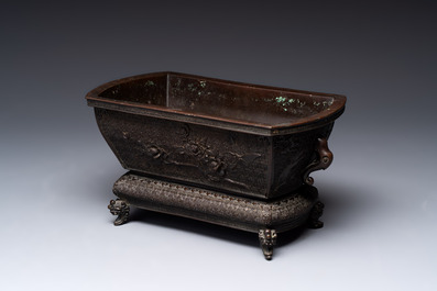 A Chinese bronze ritual wine vessel and a Japanese jardini&egrave;re, 17/19th C.