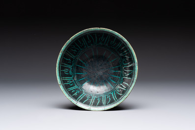 Two turquoise-and-black-glazed bowls, Kashan, 13/14th C.