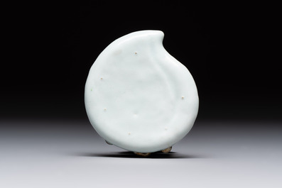 A Chinese iron-red gilt-decorated celadon-glazed peach-shaped brushwasher, 18th C.