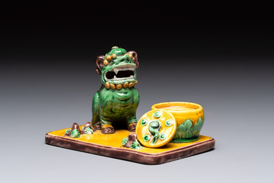 A pair of Chinese sancai-glazed Buddhist lions and an inkwell, 19th C.