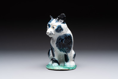 A fine polychrome Brussels faience model of a cat, 18th C.