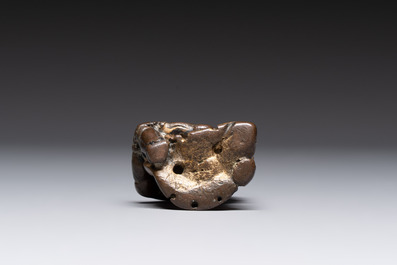 A small Chinese gilt bronze paperweight in the form of a kneeling foreigner, Ming