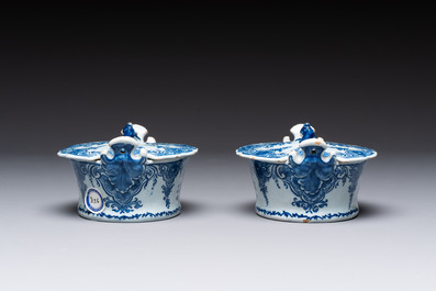 A pair of blue and white Dutch Delft butter tubs and covers, 18th C.
