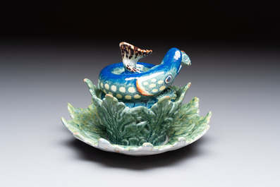A rare polychrome Dutch Delft pike tureen and cover on stand, 18th C.