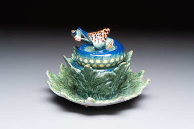 A rare polychrome Dutch Delft pike tureen and cover on stand, 18th C.