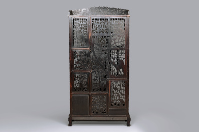 A richly carved Chinese hongmu display cabinet, Canton, 19th C.