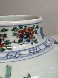 A pair of Chinese wucai vases and covers with court ladies and playing boys, Transitional period