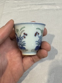 A pair of Chinese doucai 'narcissus' wine cups, Guangxu mark and of the period