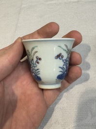 A pair of Chinese doucai 'narcissus' wine cups, Guangxu mark and of the period