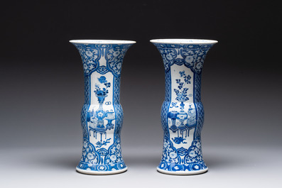 A pair of Chinese blue and white 'gu' vases with floral design, Kangxi