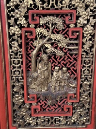 A large and fine Chinese gilt-red-lacquered cabinet with figures and antiquities, 19th C.