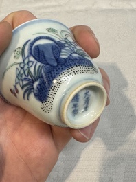 A pair of Chinese doucai 'narcissus' wine cups, Guangxu mark and of the period