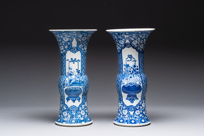 A pair of Chinese blue and white 'gu' vases with floral design, Kangxi