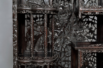A richly carved Chinese hongmu display cabinet, Canton, 19th C.